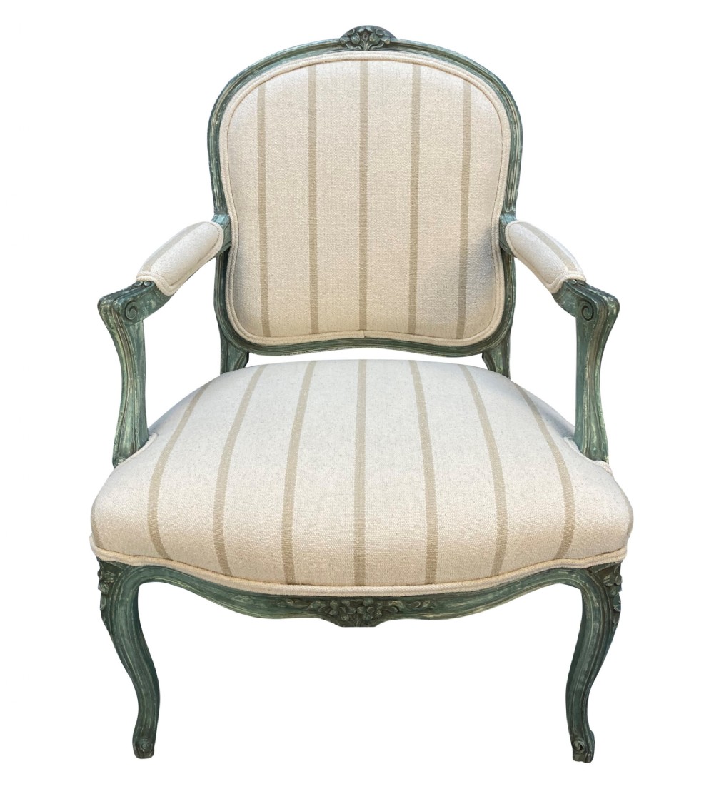 A pair of Louis XV style armchairs featuring distressed green painted frames, carved floral accents, cabriole legs, and neutral striped upholstery. View II