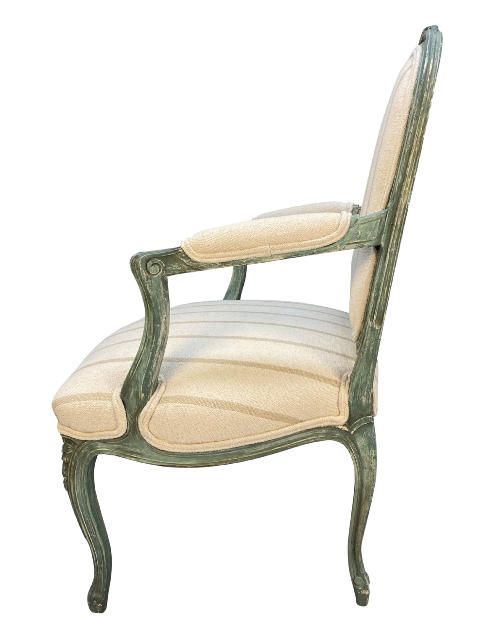A pair of Louis XV style armchairs featuring distressed green painted frames, carved floral accents, cabriole legs, and neutral striped upholstery. View IV