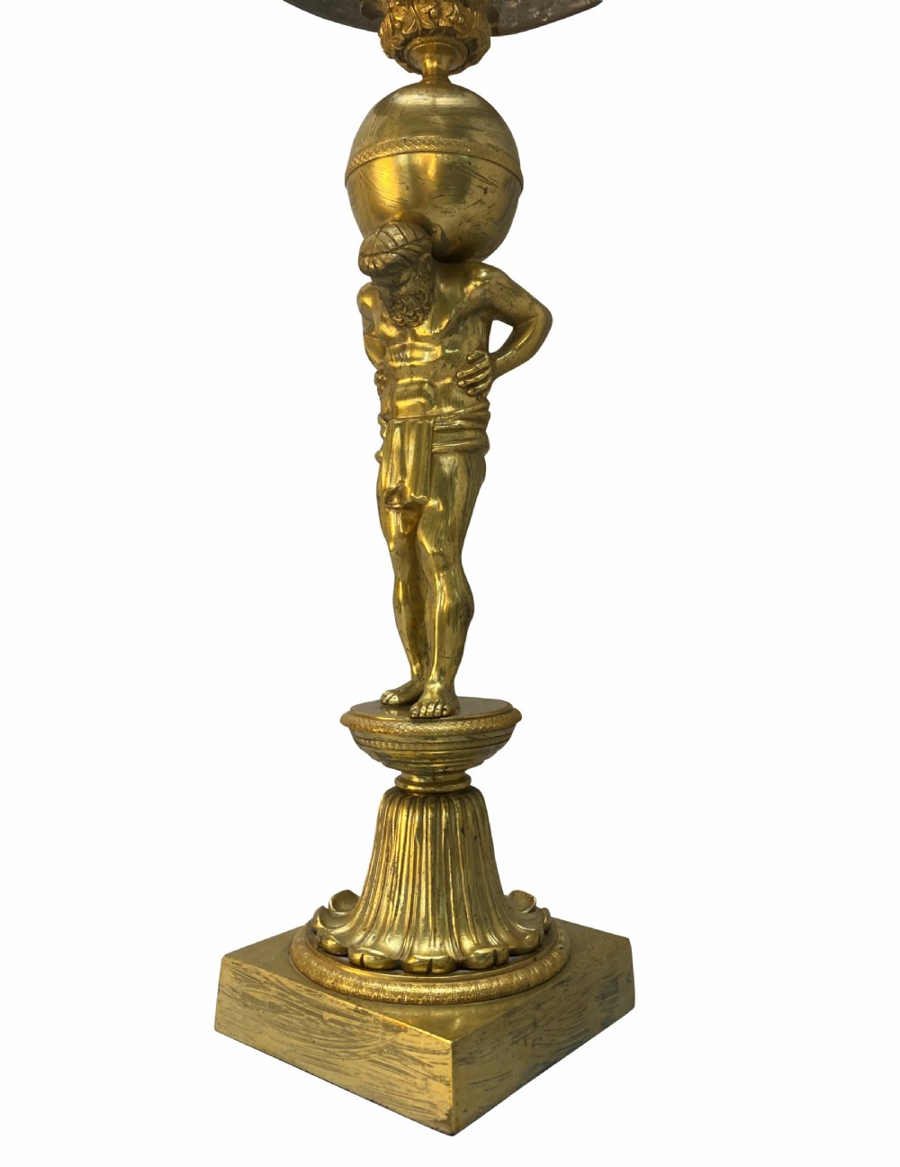 An English Regency gilt-bronze table lamp featuring a figure of Atlas supporting a sphere beneath a frosted glass dome shade. View II