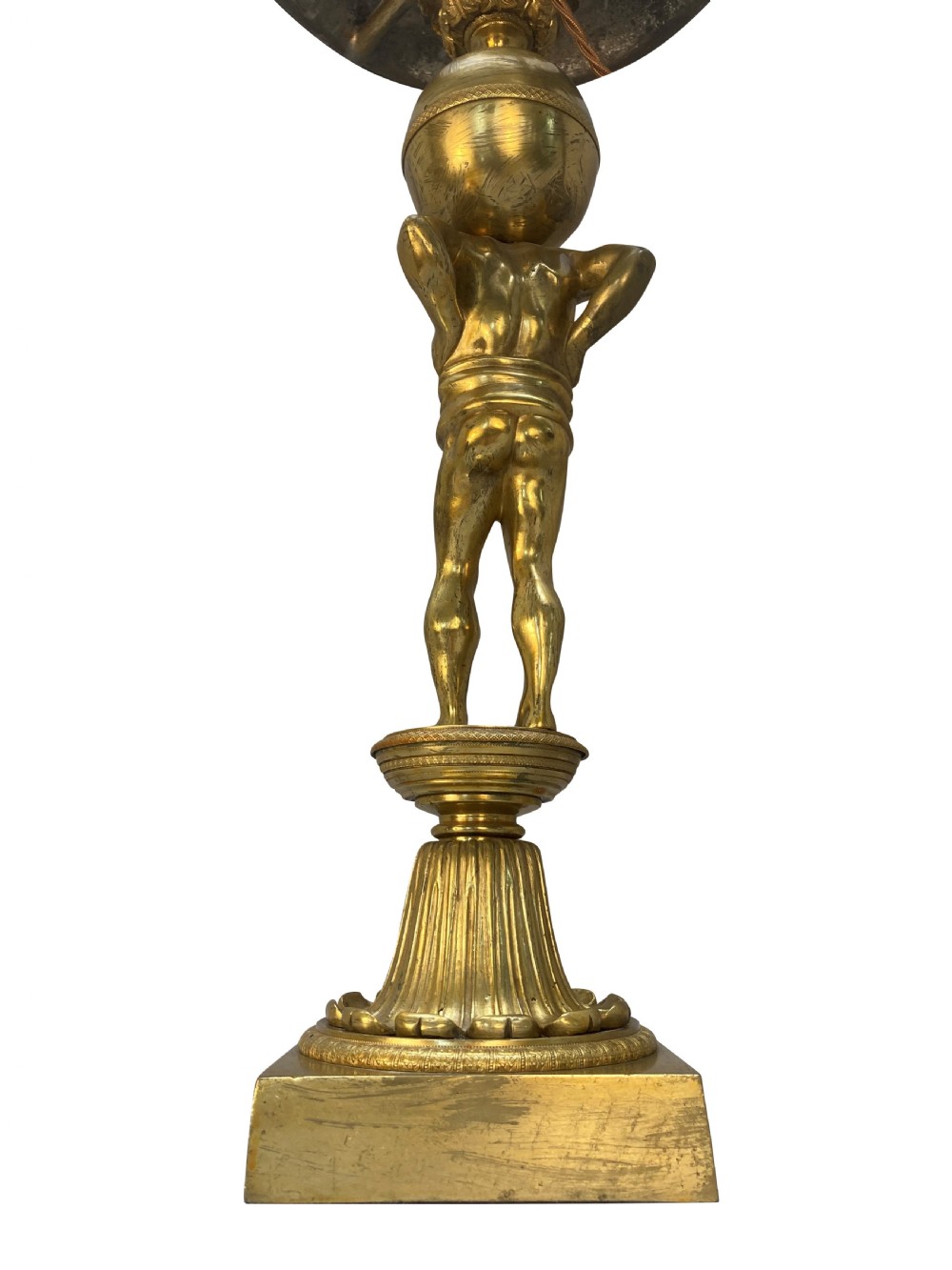 An English Regency gilt-bronze table lamp featuring a figure of Atlas supporting a sphere beneath a frosted glass dome shade. View III