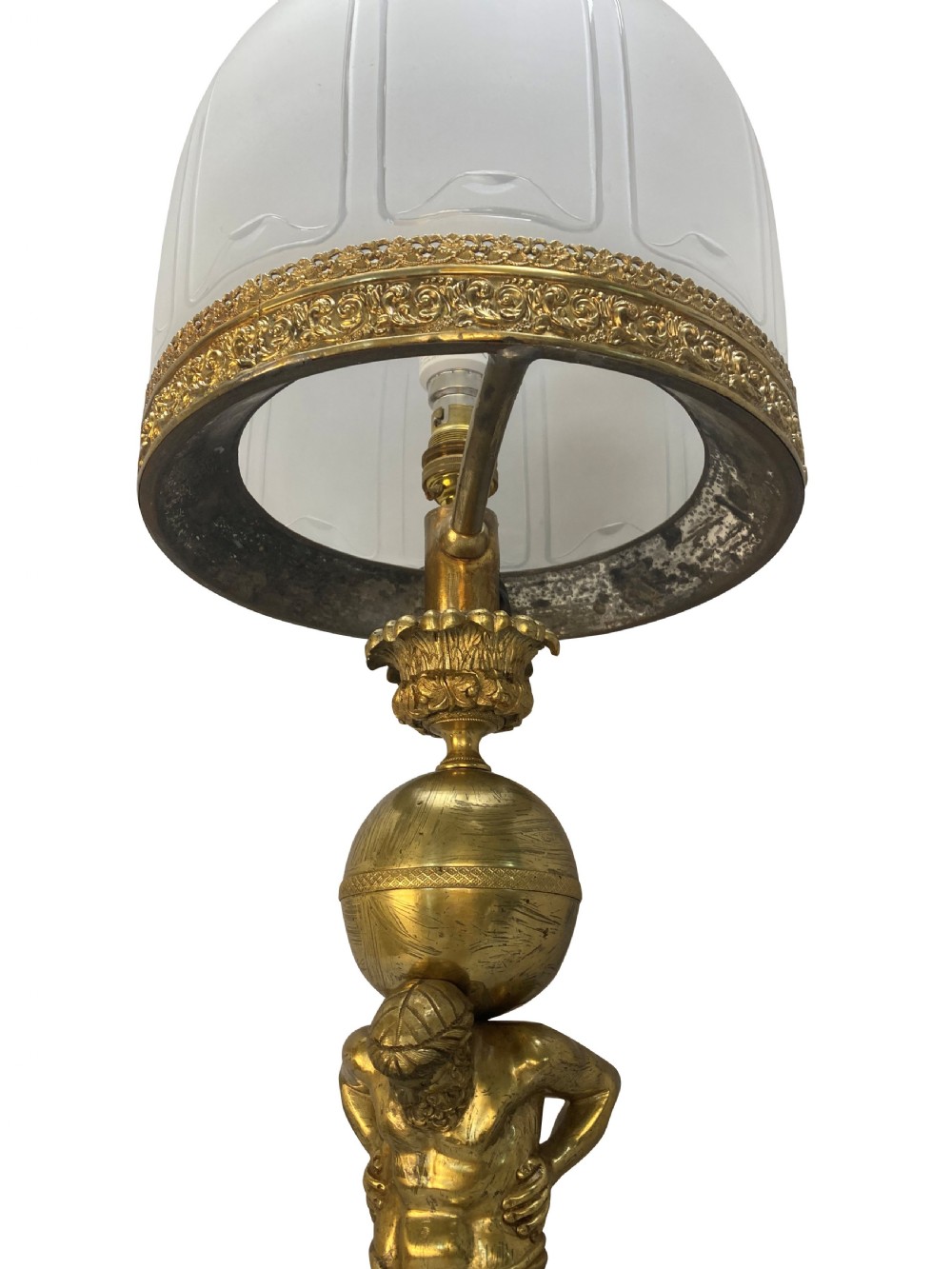 An English Regency gilt-bronze table lamp featuring a figure of Atlas supporting a sphere beneath a frosted glass dome shade. View VII
