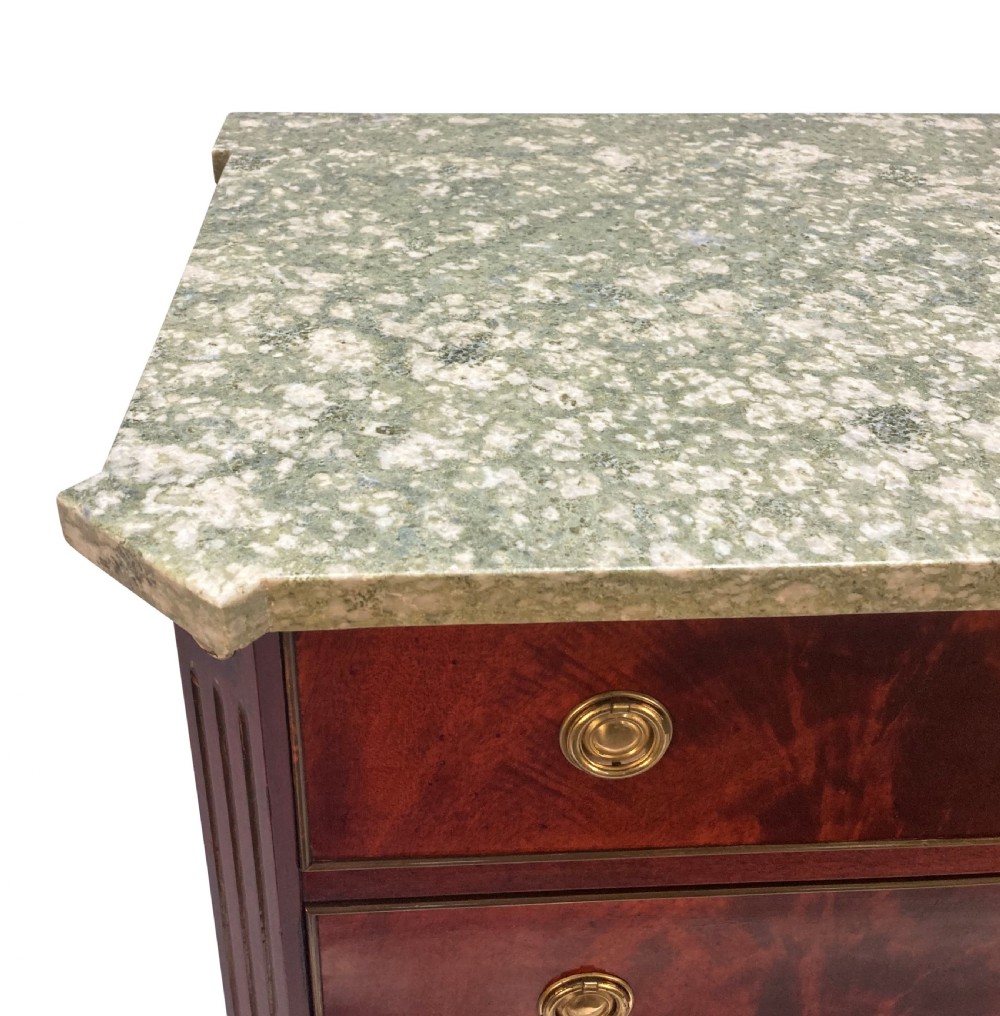 A 19th-century Russian flame mahogany commode featuring three drawers with brass ring handles, fluted corner pilasters, square tapered legs, and a pale green marble top. View III