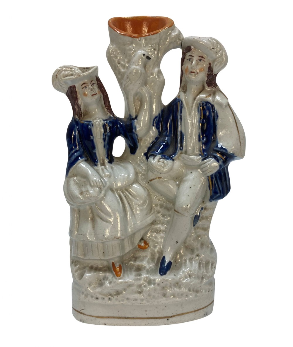 A set of five Victorian Staffordshire flatback earthenware figures depicting couples, hunters, and spill vases with colourful hand-painted enamel glazes. View III
