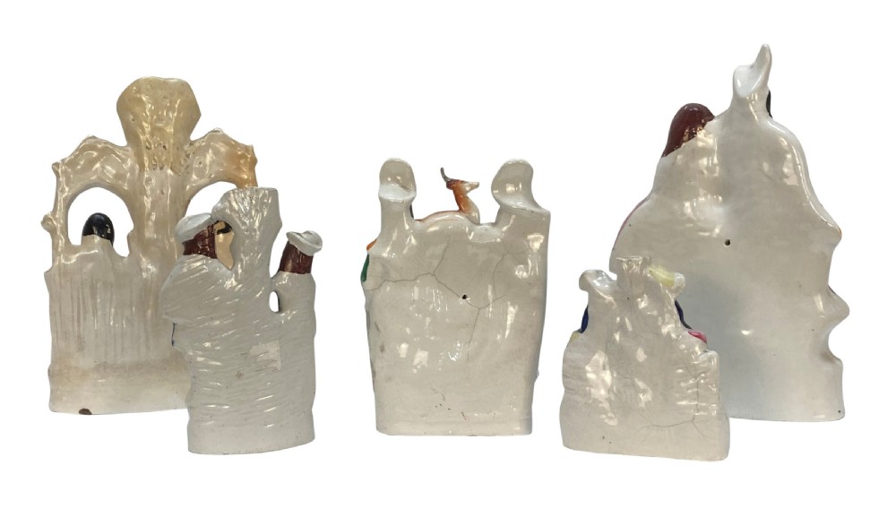 A set of five Victorian Staffordshire flatback earthenware figures depicting couples, hunters, and spill vases with colourful hand-painted enamel glazes. View VIII