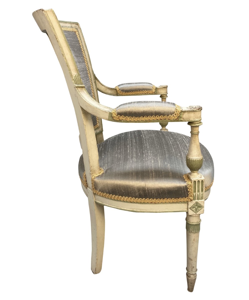 A pair of French Directoire style painted armchairs with grey silk upholstery, fluted legs, and cream-painted frames. View III