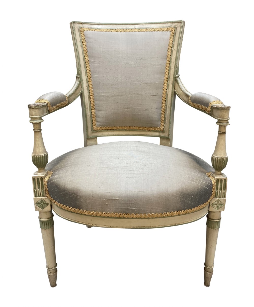 A pair of French Directoire style painted armchairs with grey silk upholstery, fluted legs, and cream-painted frames. View VI