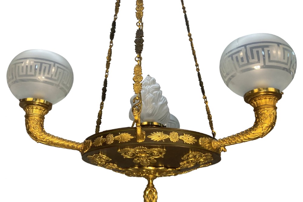A Regency period gilt and patinated bronze colza hanging light featuring etched frosted glass shades with Greek key motifs. View II