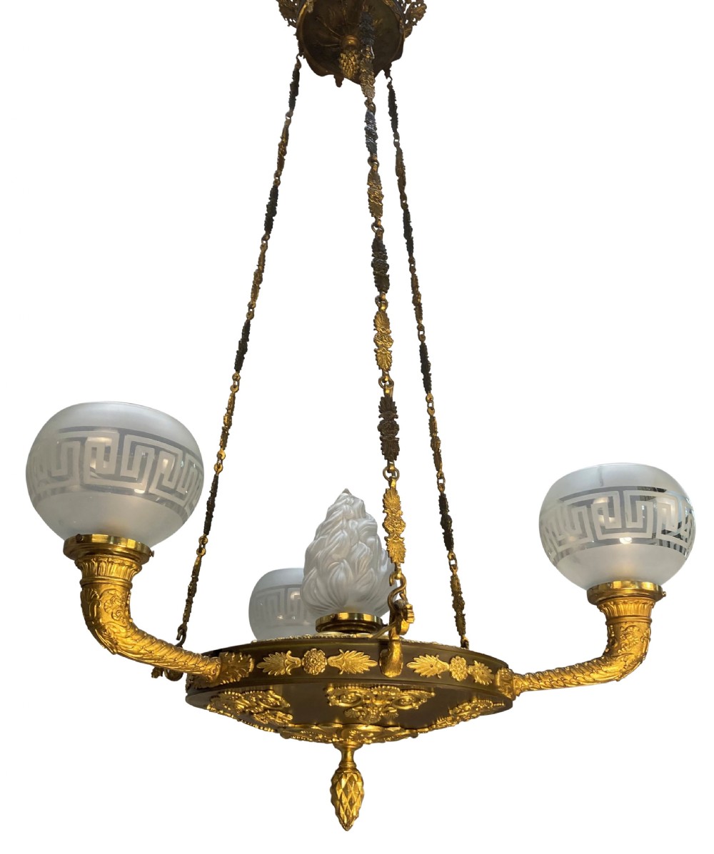 A Regency period gilt and patinated bronze colza hanging light featuring etched frosted glass shades with Greek key motifs. View VII