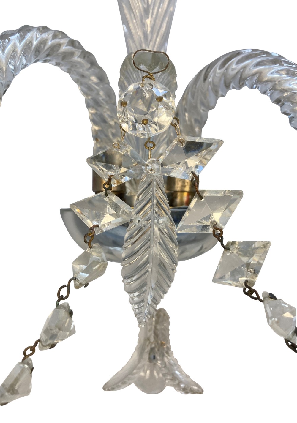 A pair of 1930s Baccarat clear lead crystal twin-branch wall sconces with twisted arms and cut glass candle cups. View VI
