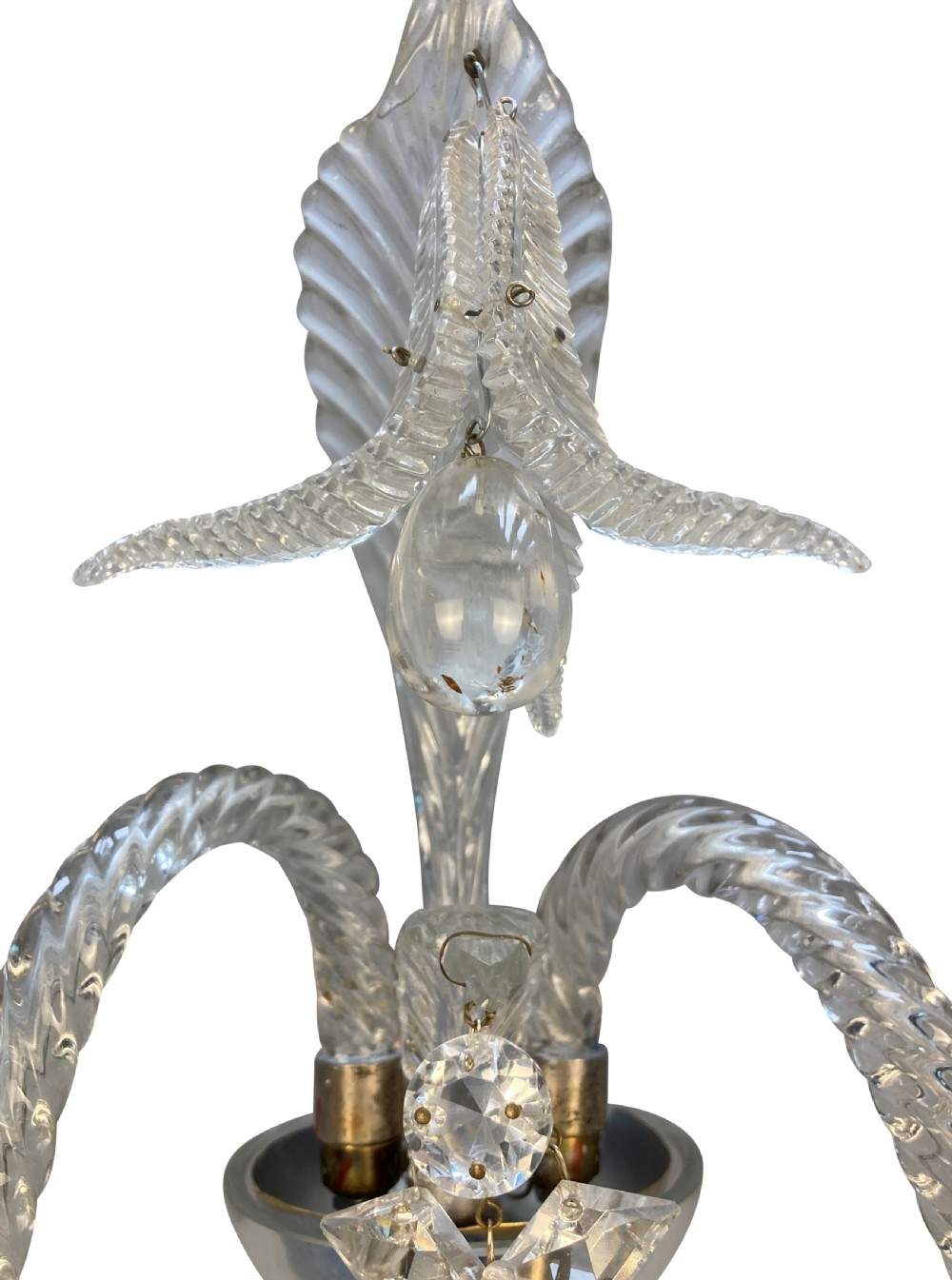 A pair of 1930s Baccarat clear lead crystal twin-branch wall sconces with twisted arms and cut glass candle cups. View VII