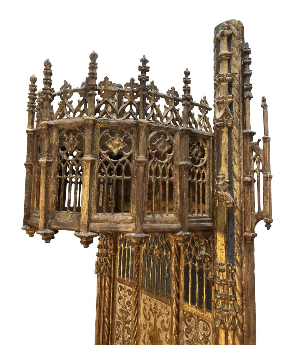 A tall 15th-century carved oak ecclesiastical throne featuring elaborate Gothic tracery, a decorative canopy, and gilded details. View XI