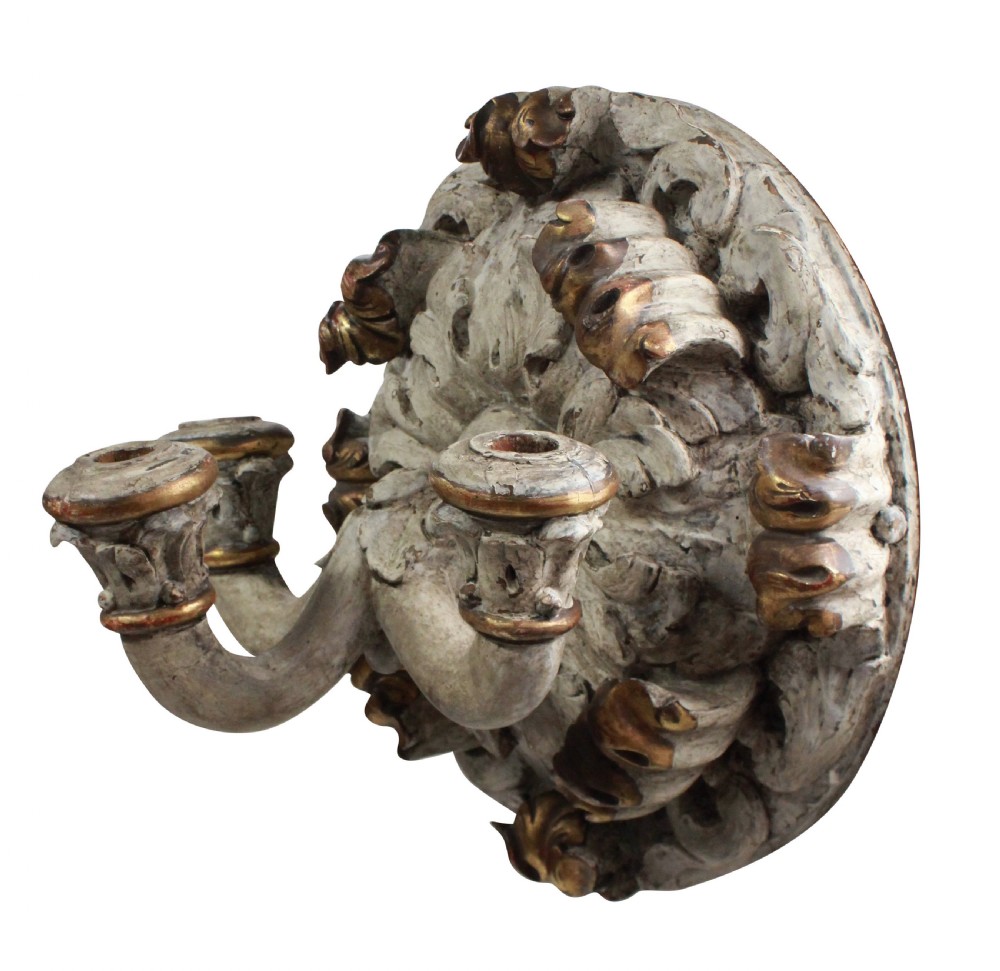 A 19th-century carved wooden three-branch wall sconce with detailed acanthus leaf decoration, distressed grey paint, and gilded accents. View III