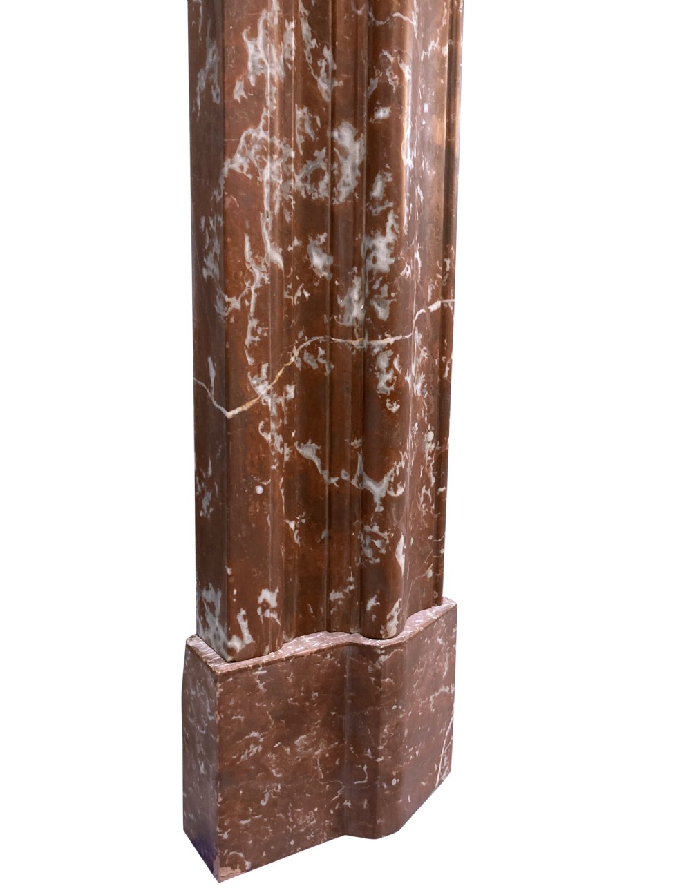 A red and white veined marble fire surround with a convex bolection moulding profile and block plinth bases. View IV