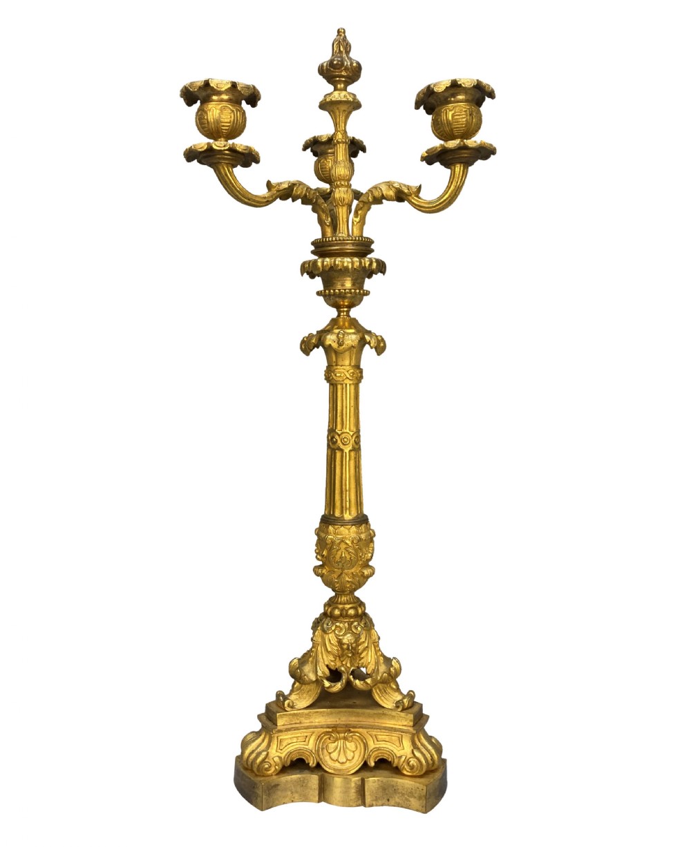 A pair of French Charles X gilt bronze three-light candelabra with scrolling acanthus leaves and fluted columns. View II