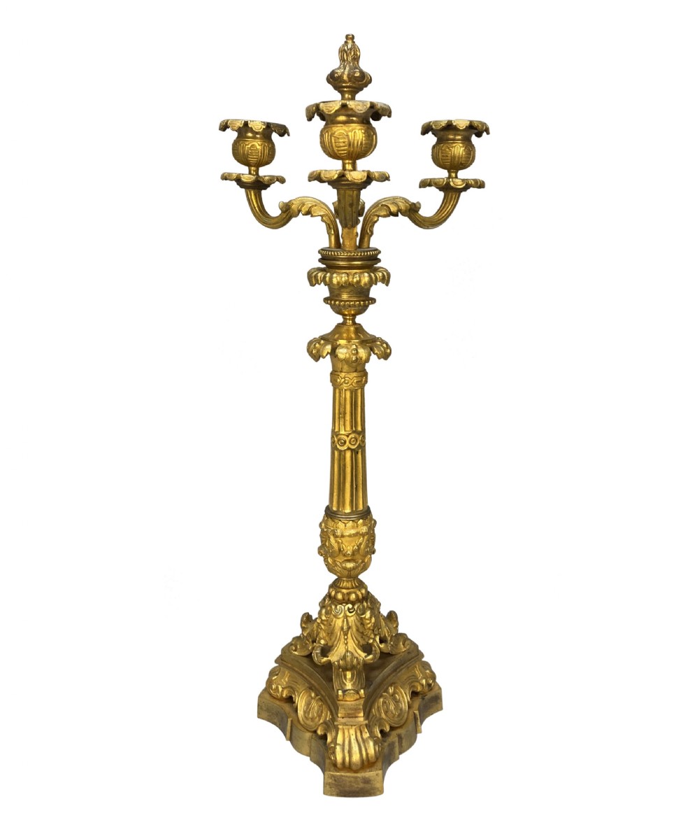 A pair of French Charles X gilt bronze three-light candelabra with scrolling acanthus leaves and fluted columns. View III