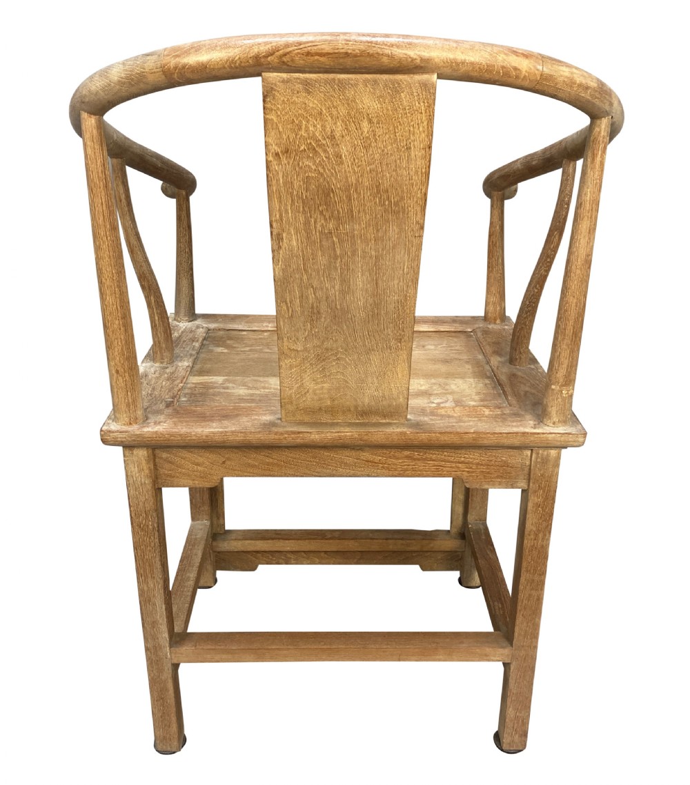 A pair of light brown pickled elm Chinese horseshoe armchairs featuring continuous curved crest rails and central back splats. View IV