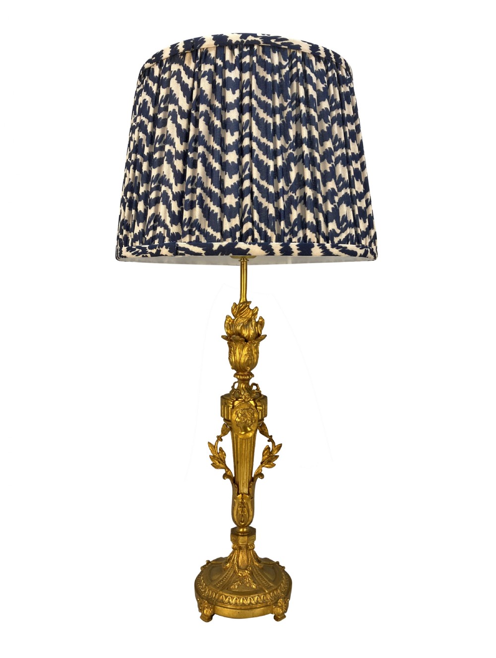 A pair of French Louis XVI style gold ormolu candlestick table lamps with gathered blue and cream patterned shades. View II