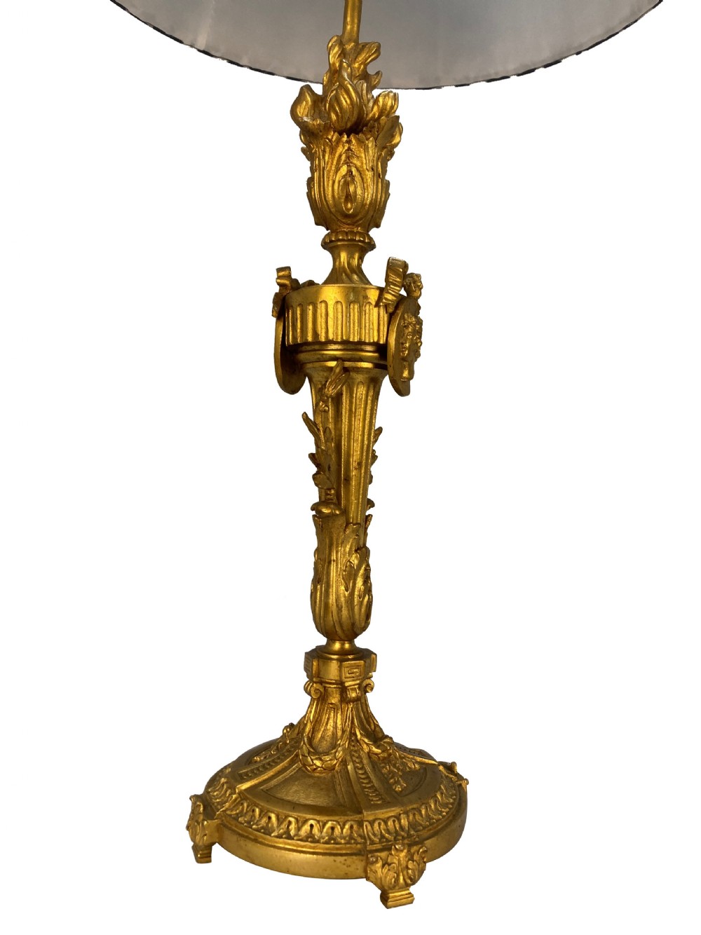 A pair of French Louis XVI style gold ormolu candlestick table lamps with gathered blue and cream patterned shades. View VI