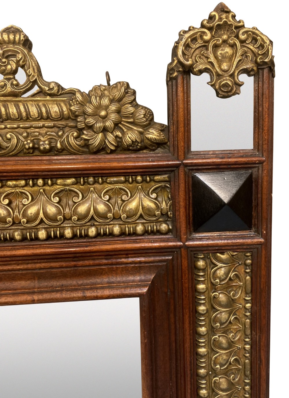 A 19th-century Flemish rectangular wall mirror featuring embossed brass panels, decorative cresting, and dark wooden moulding. View II