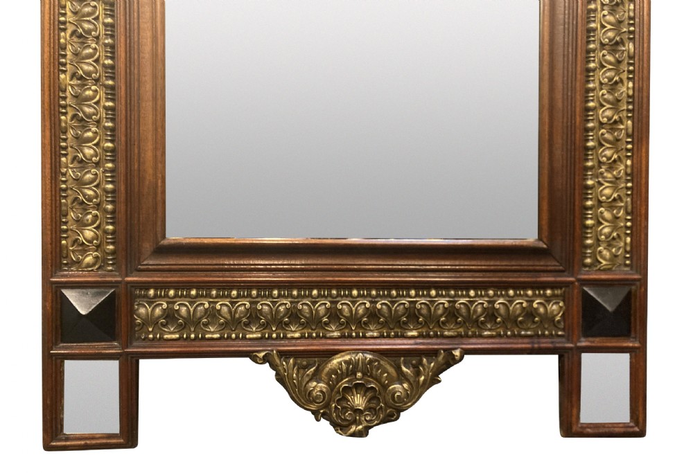 A 19th-century Flemish rectangular wall mirror featuring embossed brass panels, decorative cresting, and dark wooden moulding. View III