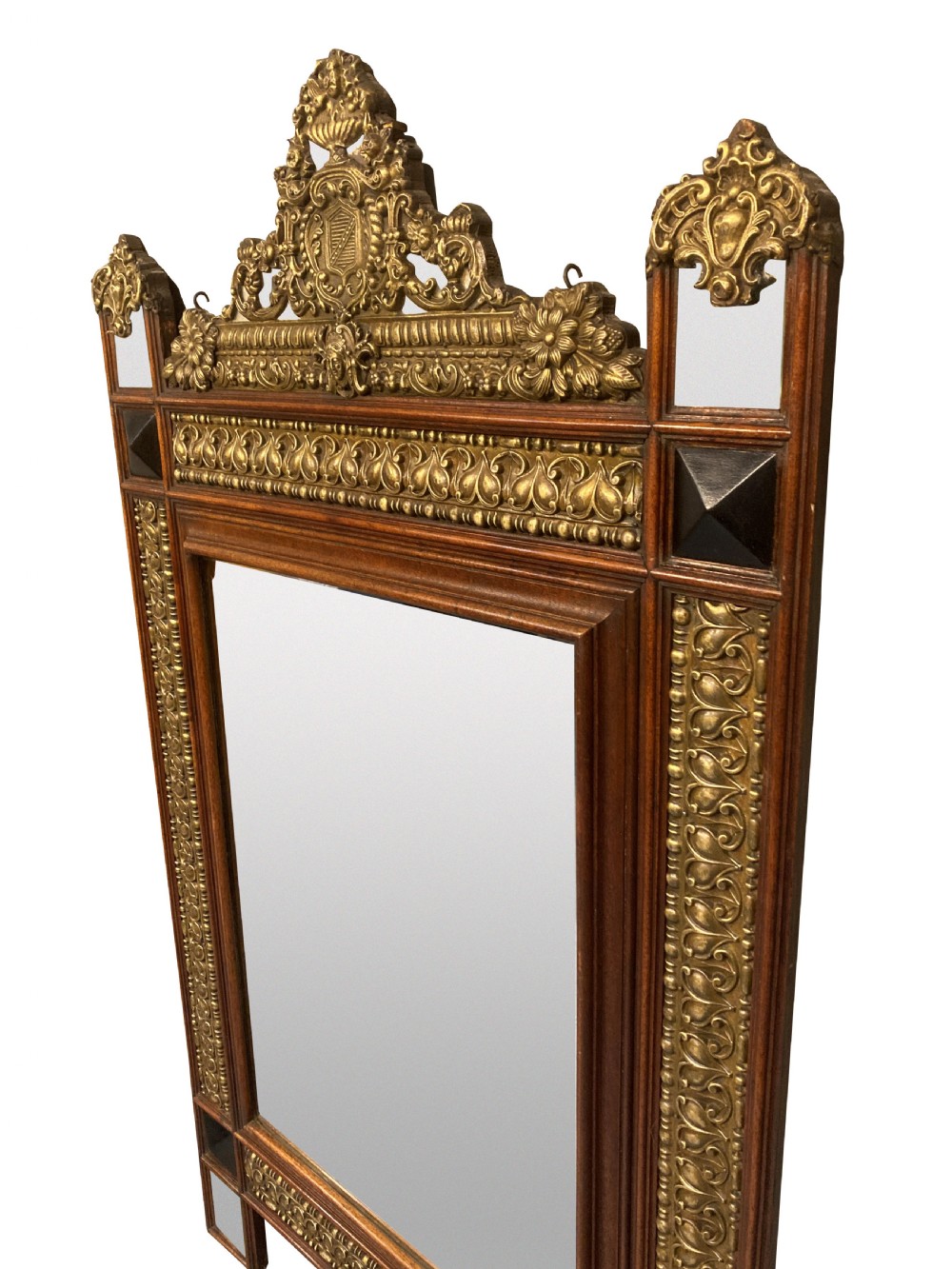 A 19th-century Flemish rectangular wall mirror featuring embossed brass panels, decorative cresting, and dark wooden moulding. View V