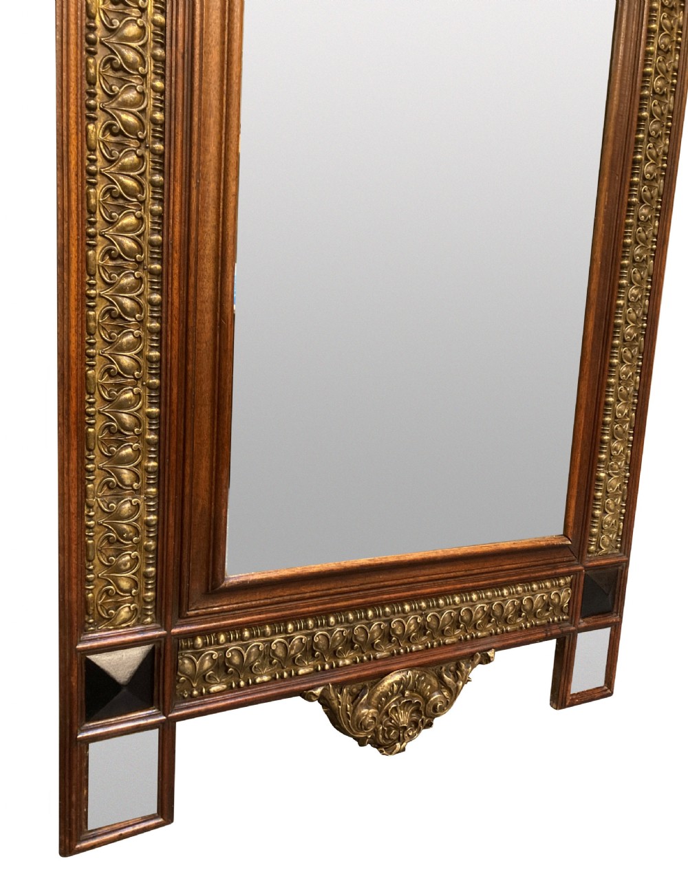 A 19th-century Flemish rectangular wall mirror featuring embossed brass panels, decorative cresting, and dark wooden moulding. View VI