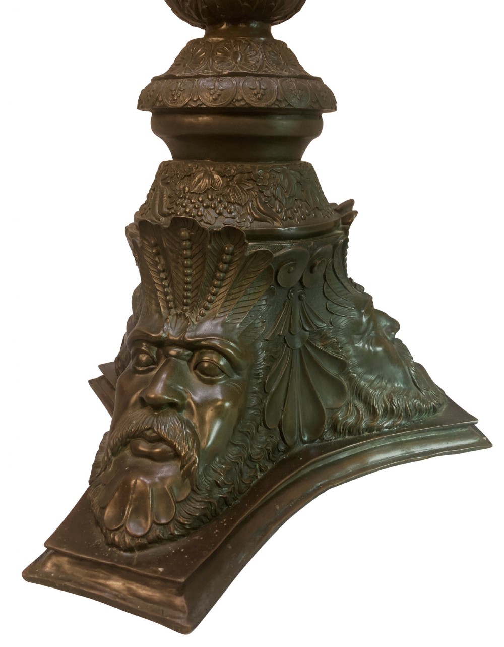 A pair of tall dark bronze Venetian torchere pedestals featuring ornate relief facial masks at the base, leaf-carved columns, and perforated top rims. View V