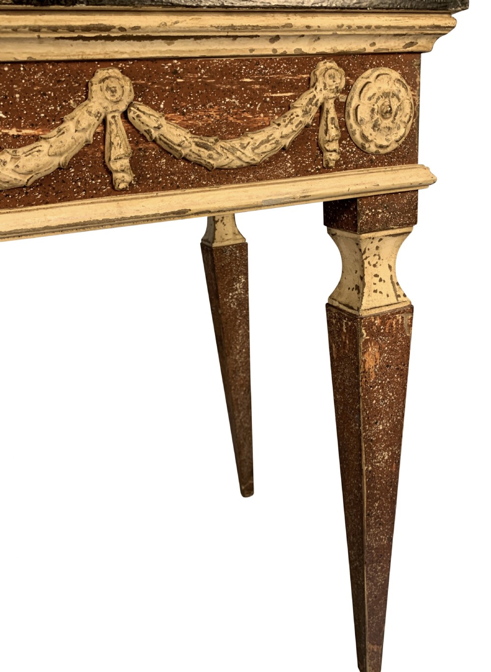 An 18th-century Italian Neoclassical console table featuring a dark marble top, square tapered legs, and a painted apron decorated with carved draped garlands. View V