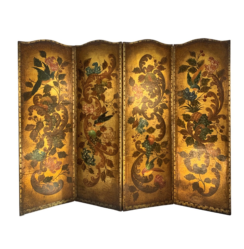 An eighteenth-century four-panel folding screen featuring embossed and hand-painted gilt leather decorated with botanical scrollwork, birds, and fruit, bordered with brass studs.
