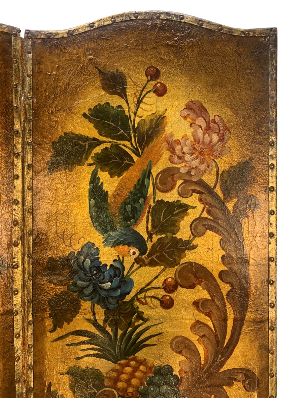 An eighteenth-century four-panel folding screen featuring embossed and hand-painted gilt leather decorated with botanical scrollwork, birds, and fruit, bordered with brass studs. View III