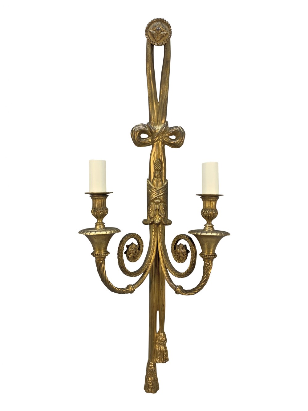 A pair of gilt bronze two-arm wall sconces featuring ribbon bow crests, tassel drops, and candle sockets. View II