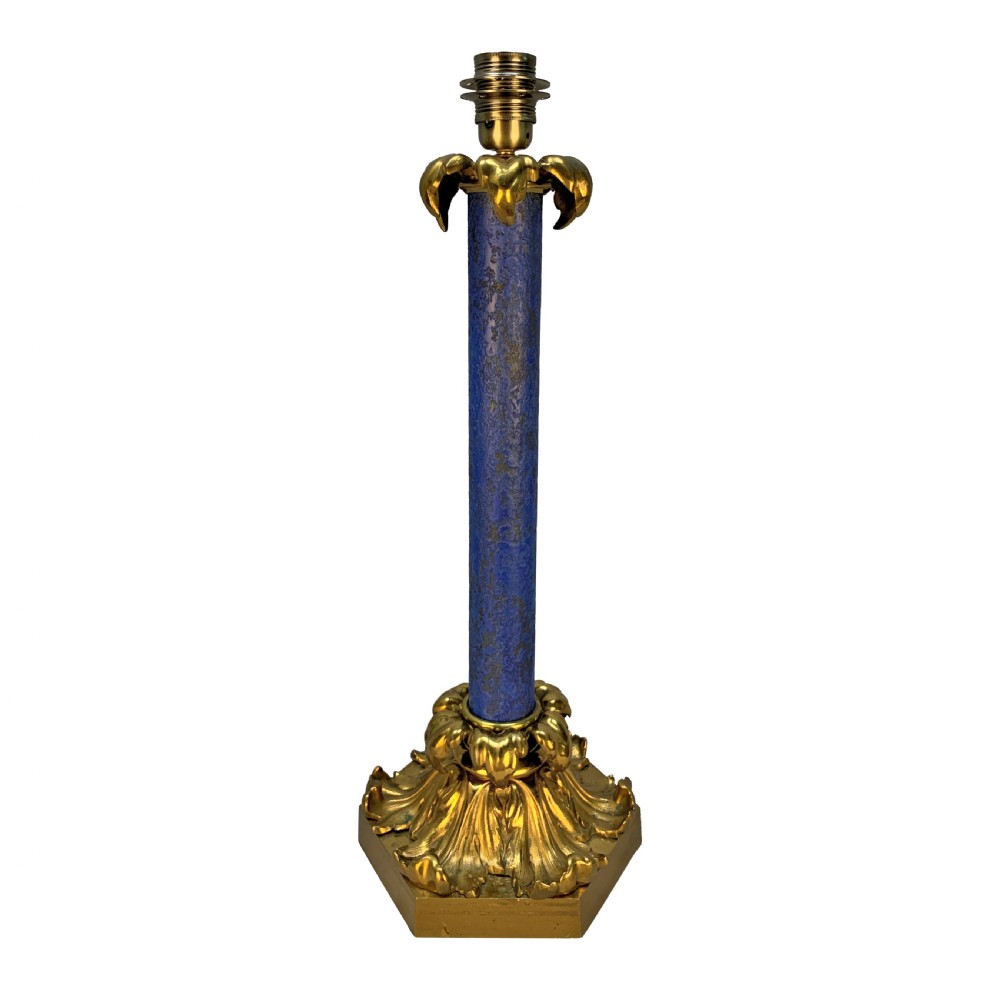 A tall William IV table lamp featuring a blue faux lapis lazuli central column anchored by an ornate gilt bronze base with acanthus leaf details.