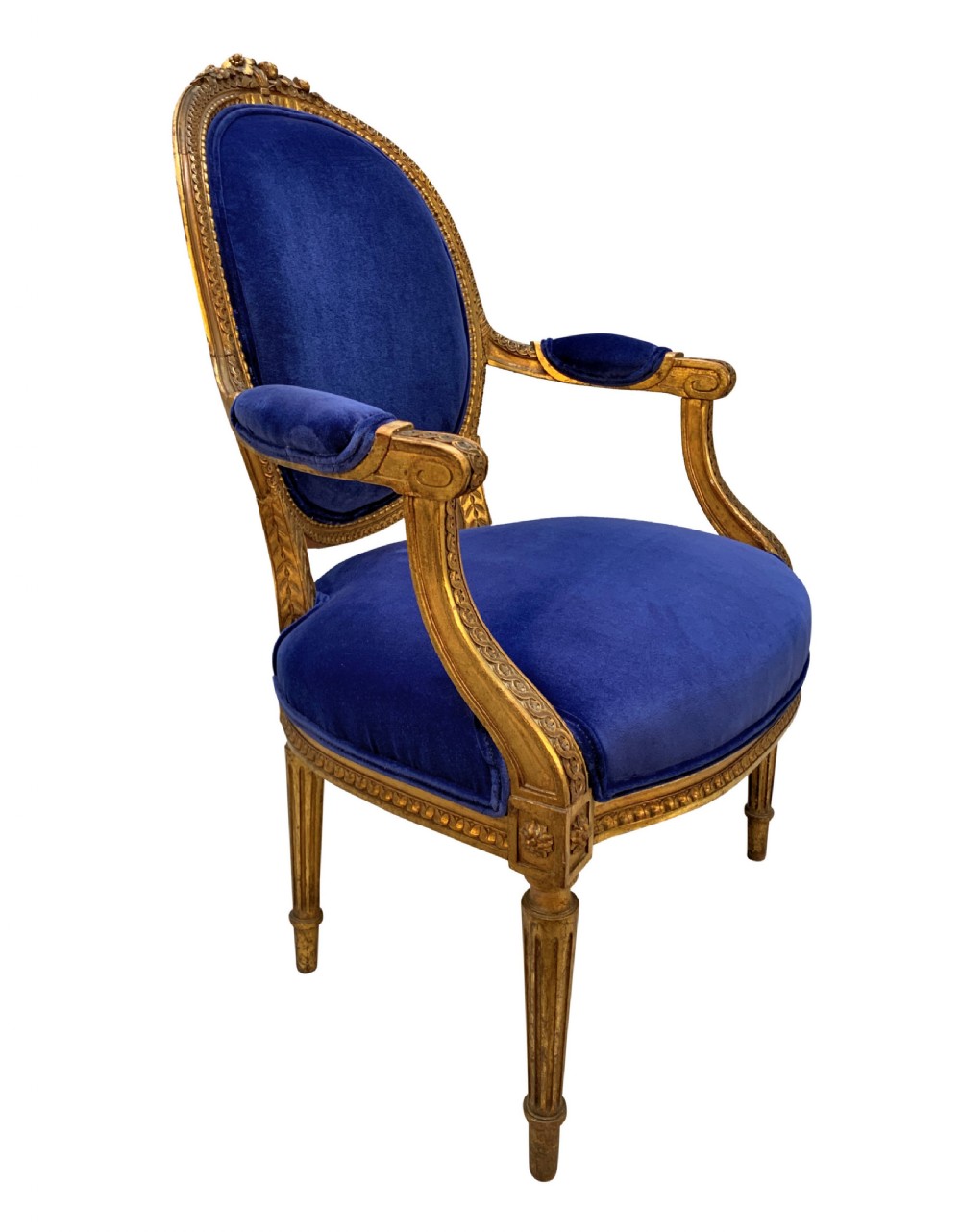 A set of four Louis XVI style armchairs featuring carved giltwood frames with oval medallion backs and royal blue velvet upholstery. View III