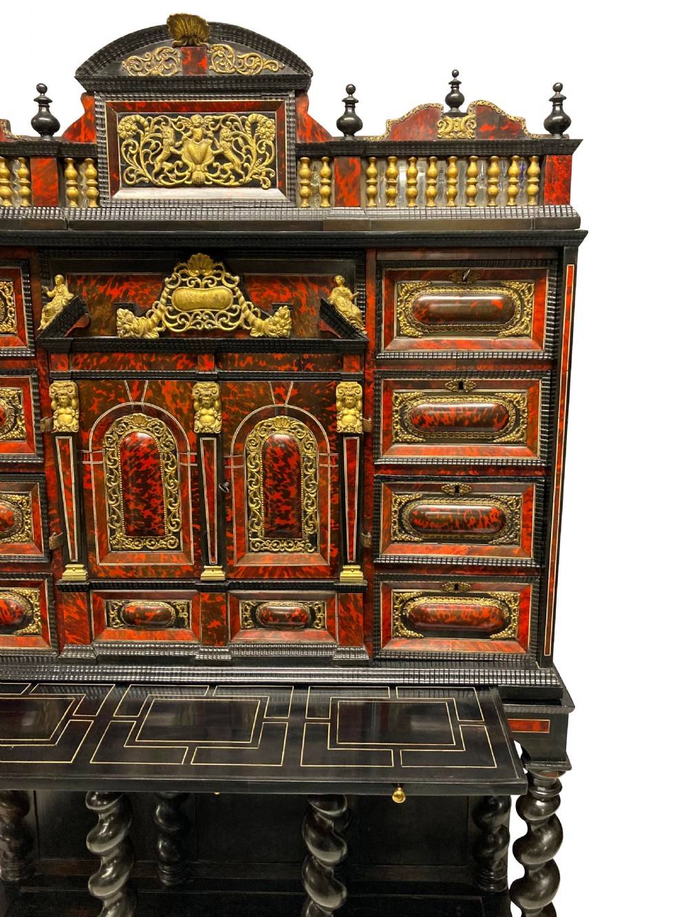 A 17th-century Flemish architectural cabinet on stand featuring red tortoiseshell veneered drawer fronts, gilt bronze mounts, and six ebonised barley-twist legs. View II