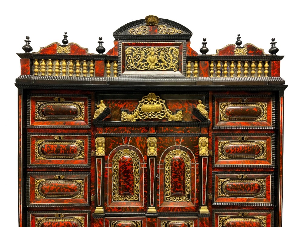 A 17th-century Flemish architectural cabinet on stand featuring red tortoiseshell veneered drawer fronts, gilt bronze mounts, and six ebonised barley-twist legs. View III