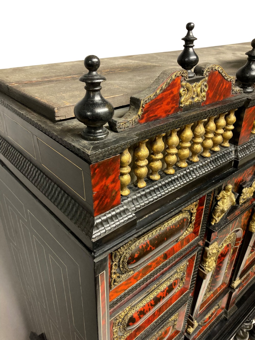 A 17th-century Flemish architectural cabinet on stand featuring red tortoiseshell veneered drawer fronts, gilt bronze mounts, and six ebonised barley-twist legs. View VI