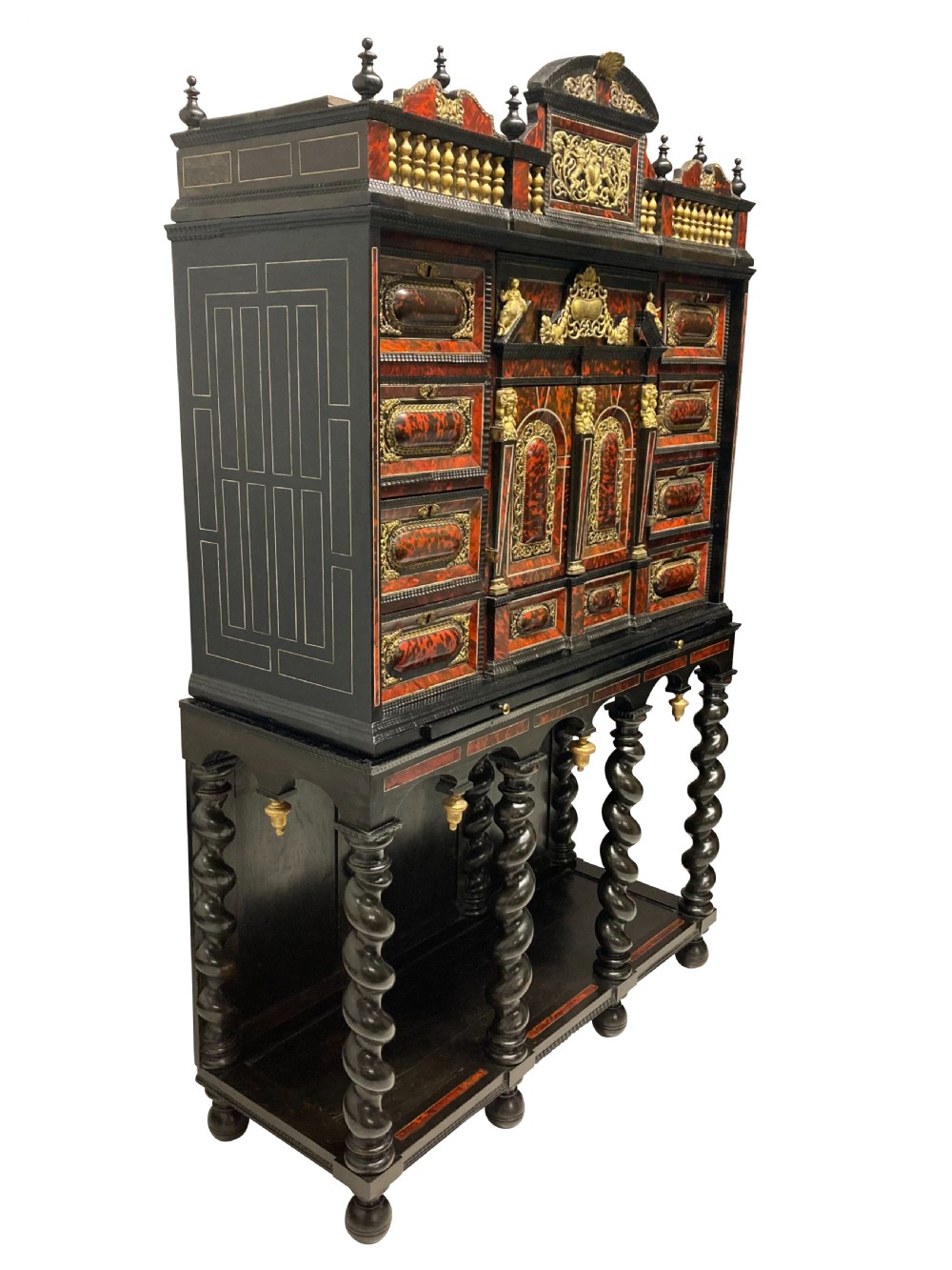 A 17th-century Flemish architectural cabinet on stand featuring red tortoiseshell veneered drawer fronts, gilt bronze mounts, and six ebonised barley-twist legs. View VIII
