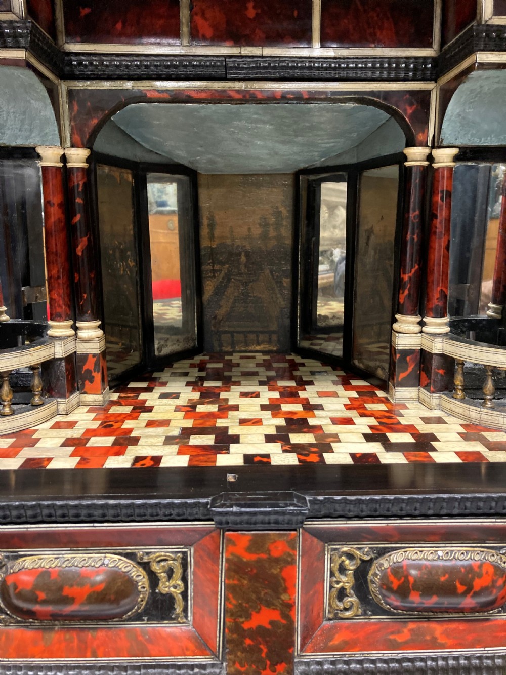 A 17th-century Flemish architectural cabinet on stand featuring red tortoiseshell veneered drawer fronts, gilt bronze mounts, and six ebonised barley-twist legs. View XI