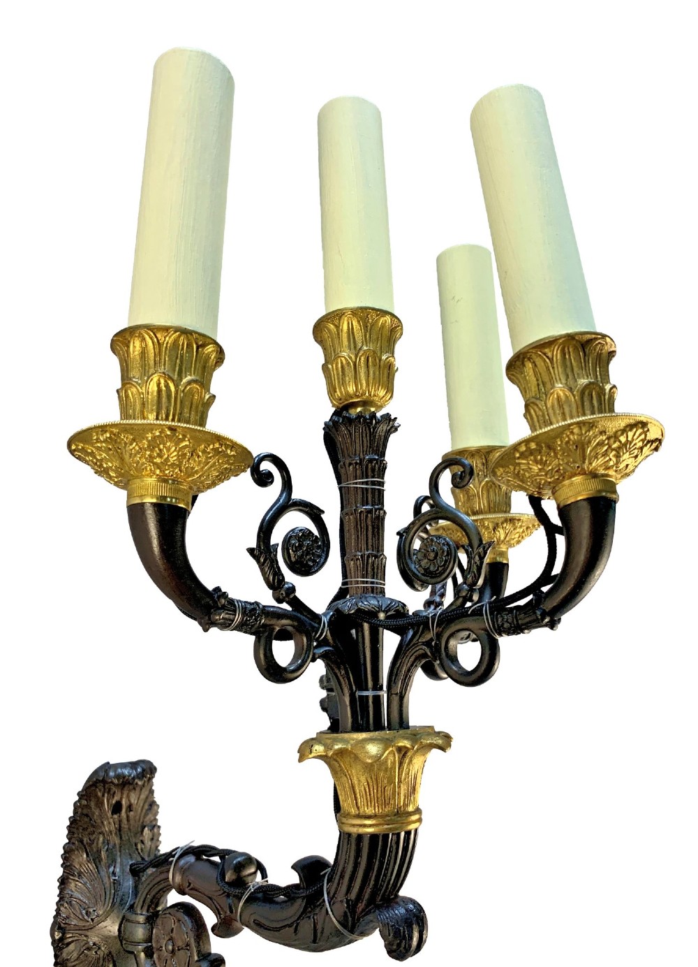 A pair of French Empire style wall lights featuring dark patinated bronze curved branches with four gilt bronze candle sockets each. View III