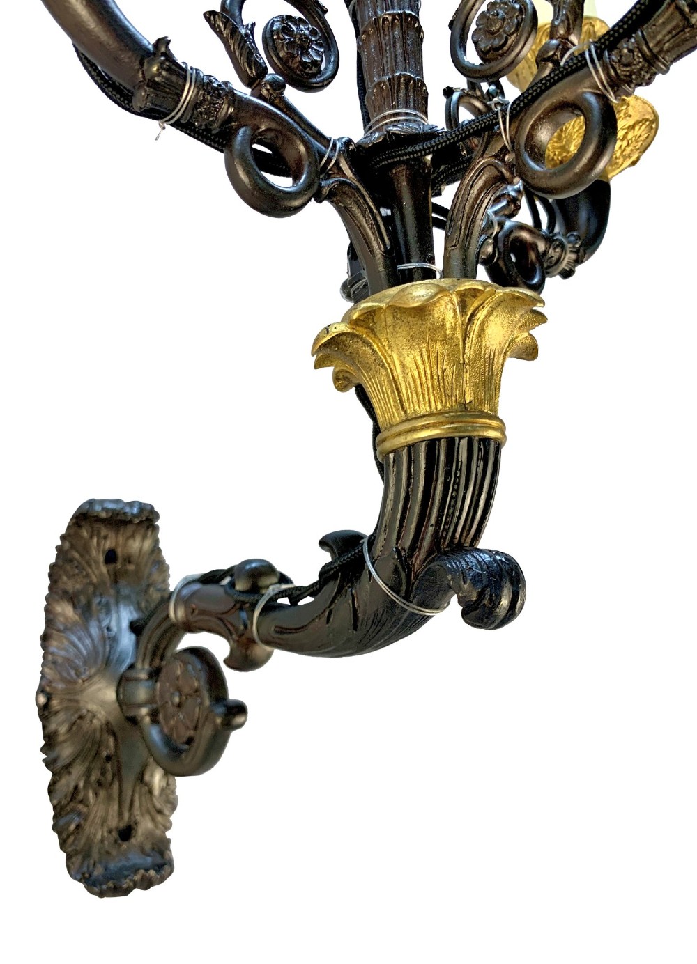 A pair of French Empire style wall lights featuring dark patinated bronze curved branches with four gilt bronze candle sockets each. View V