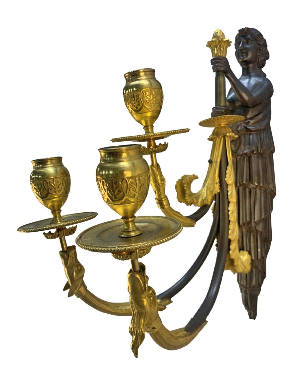 A pair of Neoclassical wall lights featuring dark patinated bronze female caryatid figures holding gilt bronze multi-arm candle holders with urn nozzles. View IV