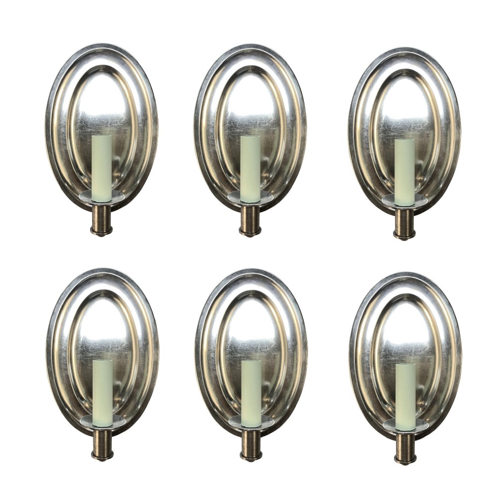 A set of six oval silver-plated single-arm wall sconces featuring reflective backplates and candle-style light sockets.