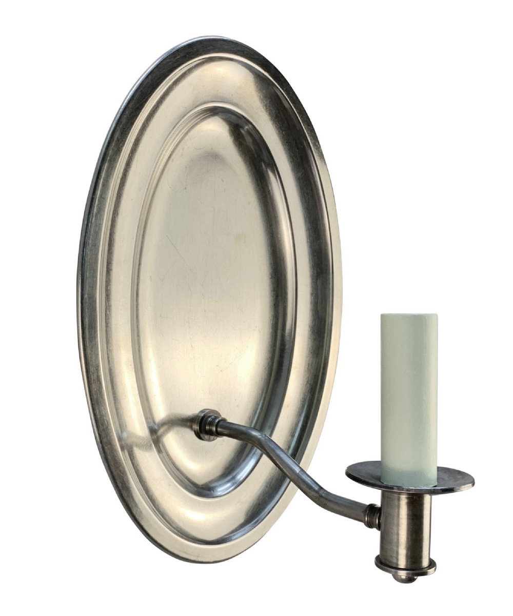 A set of six oval silver-plated single-arm wall sconces featuring reflective backplates and candle-style light sockets. View II