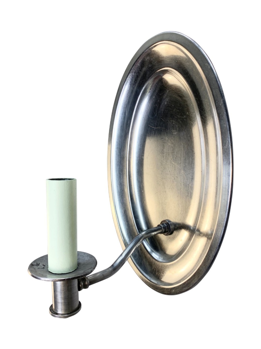 A set of six oval silver-plated single-arm wall sconces featuring reflective backplates and candle-style light sockets. View VI