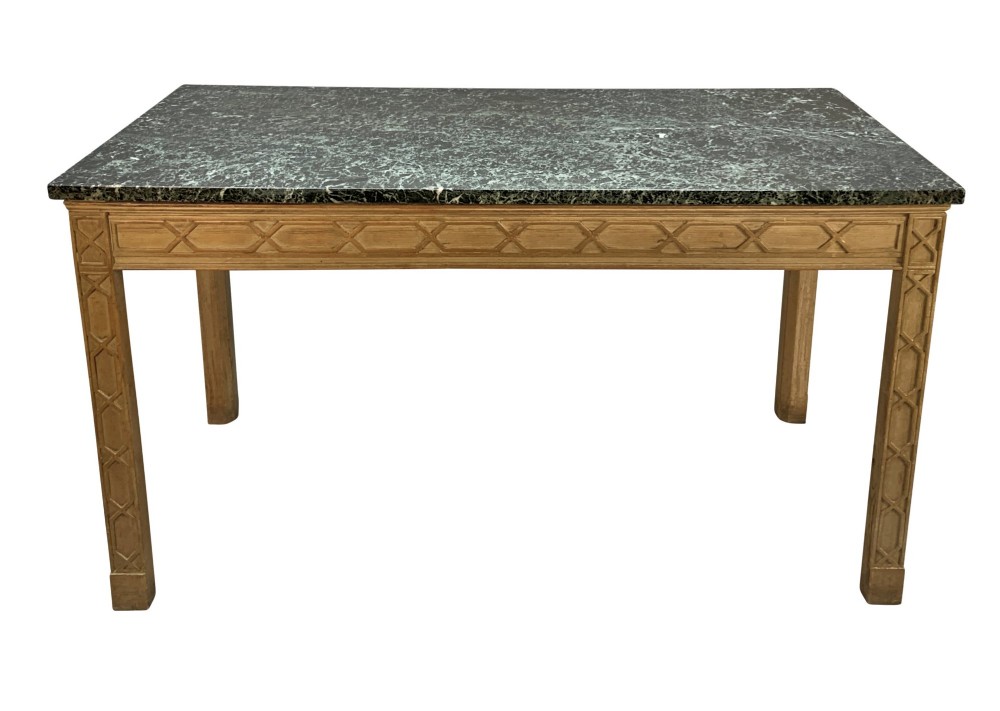 A pair of George III style natural pine console tables featuring carved geometric lattice friezes and dark green marble tops. View II