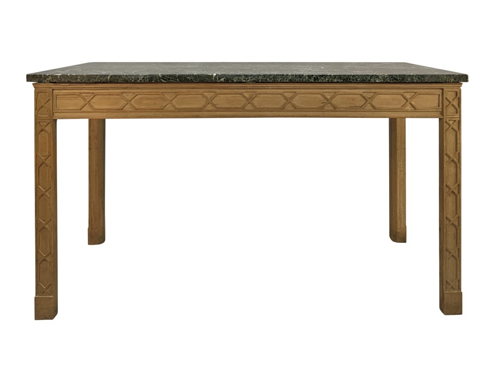 A pair of George III style natural pine console tables featuring carved geometric lattice friezes and dark green marble tops. View VI