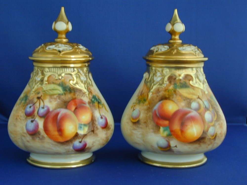 Royal Worcester matching pair of fruit painted Artist signed pot pourri vases.