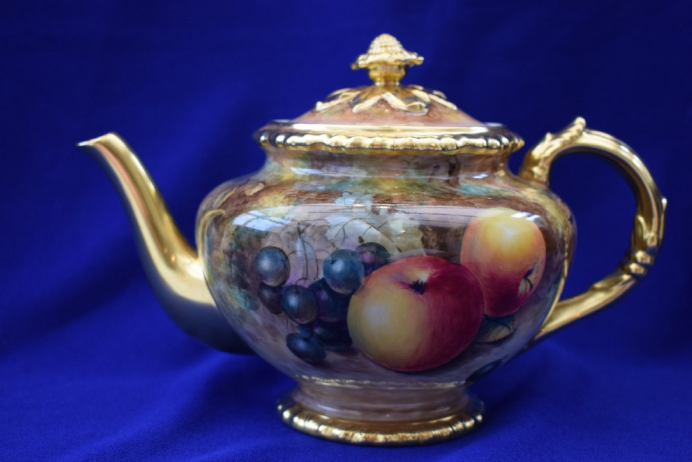 Royal Worcester rope edge painted fruit teapot of large size.