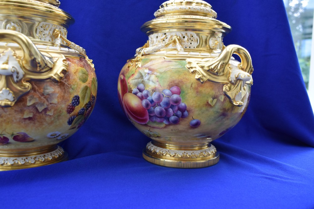 A pair of Royal Worcester painted fruit bow vases and covers View V