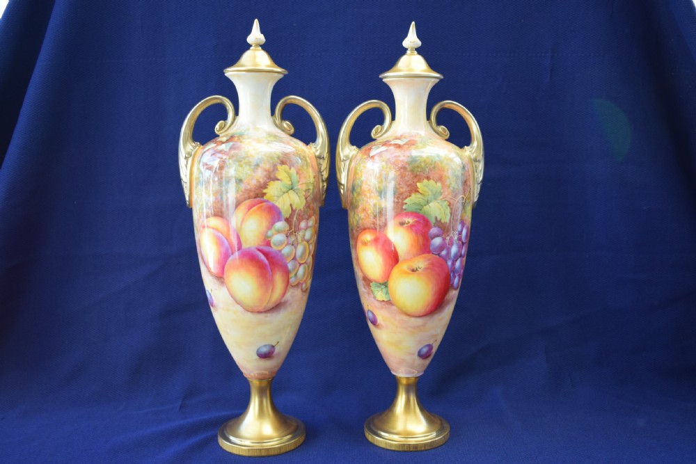 Royal Worcester pair of painted fruit vases and covers